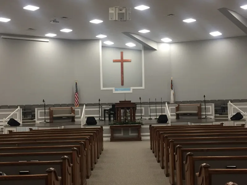 Empty Gethsemane Baptist Church sanctuary facing the platform and presentation screen