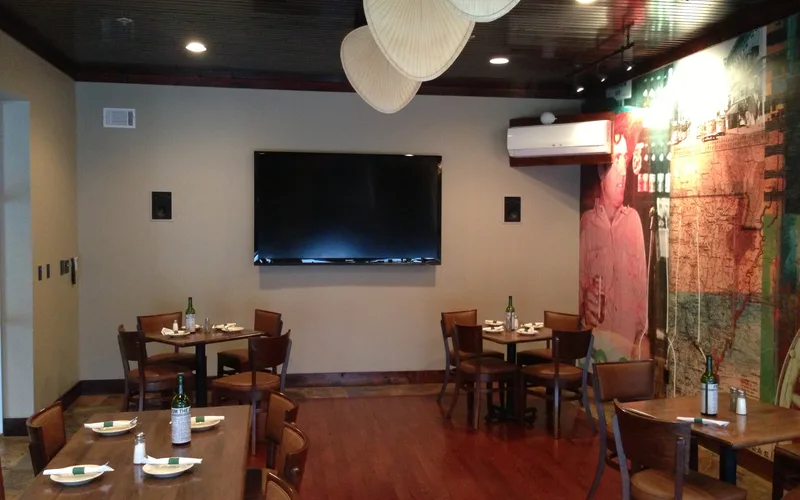 Private restaurant dining room with a feature display and in-wall speakers