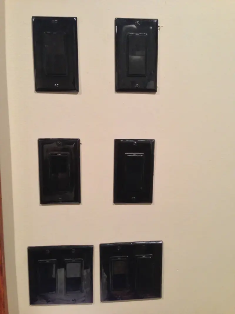 Black wall-mounted lighting controls installed at the restaurant
