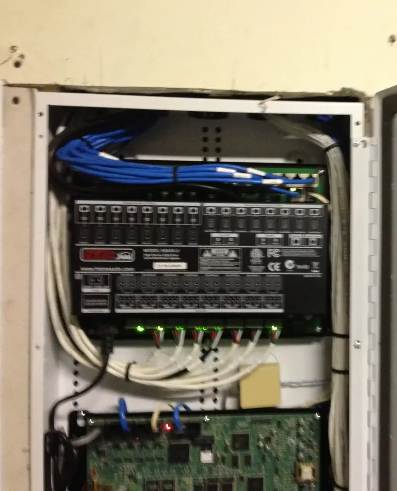 Open HAI automation and audio cabinet with structured wiring