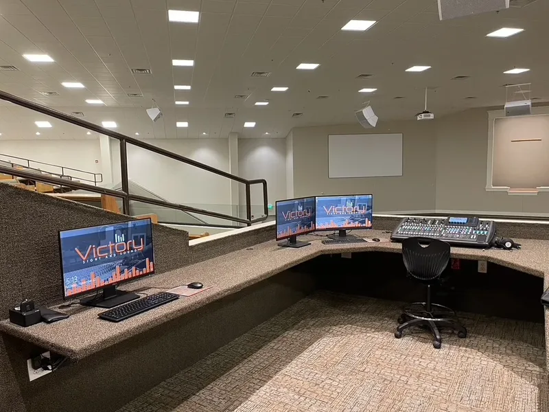 Maple Springs sound booth with presentation computer, recording computer, and digital mixing console
