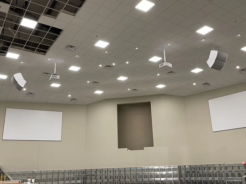 Maple Springs auditorium during construction with projection and main loudspeaker systems installed